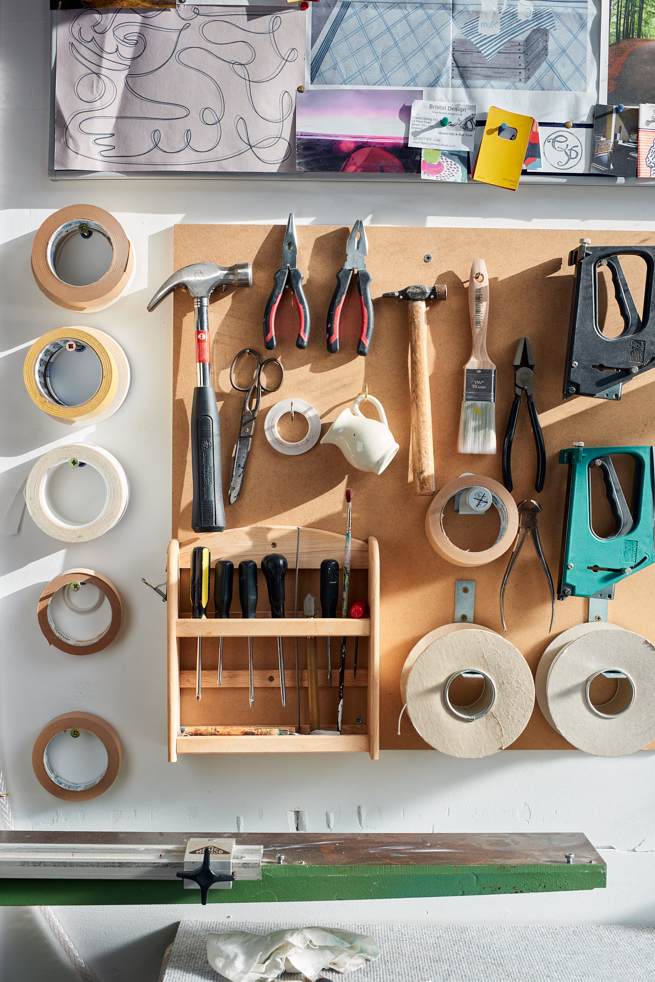 Closeup of workshop tools handing on wall